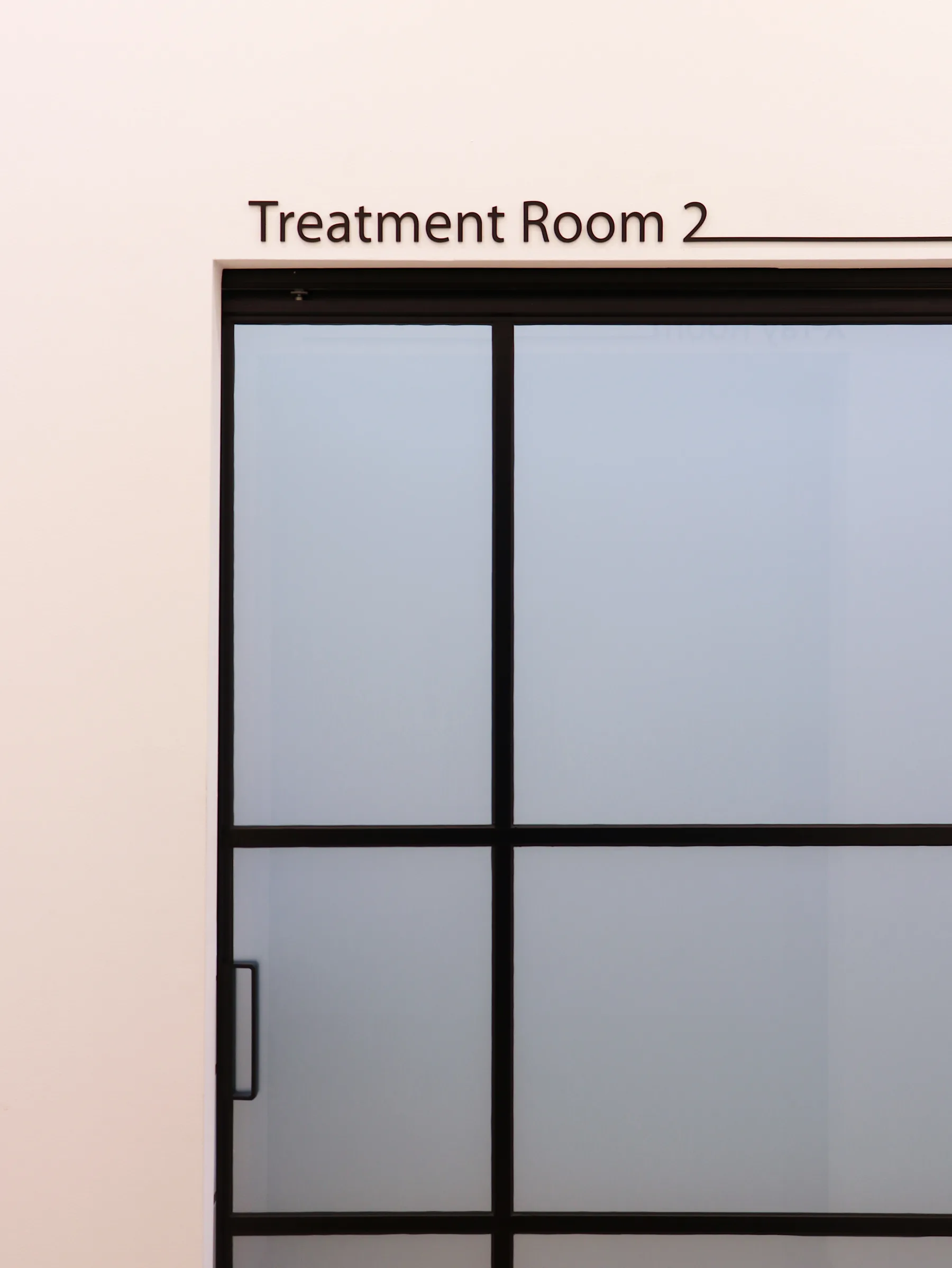 Glow Dental treatment room door detail